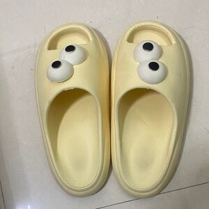 Yellow Foam Slide Clogs with Playful Eye Detail